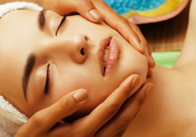 Hands on the face of a girl