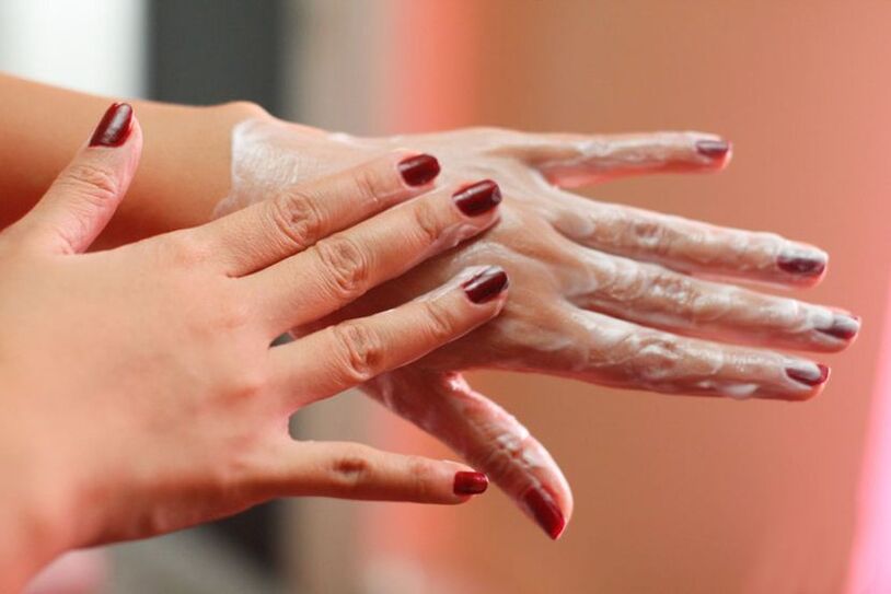 Applying a cream to the hands for skin rejuvenation